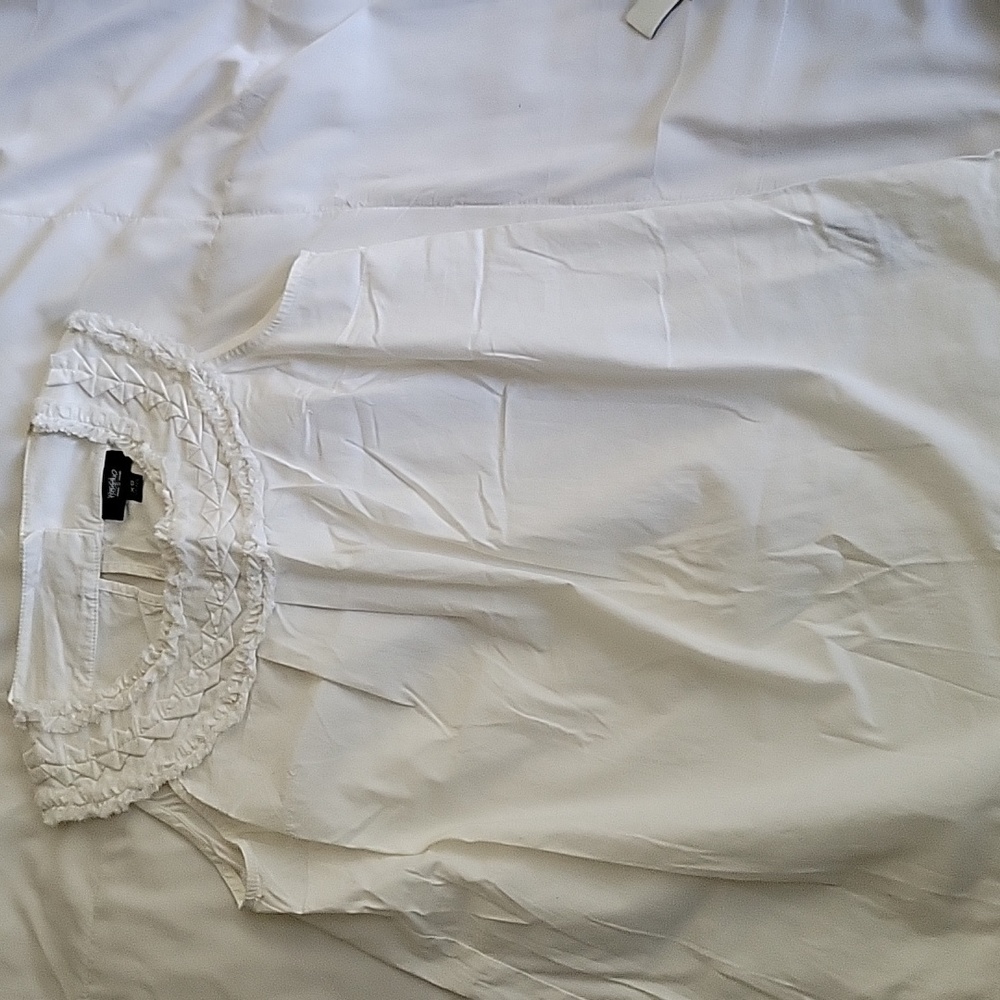 White sleeveless top